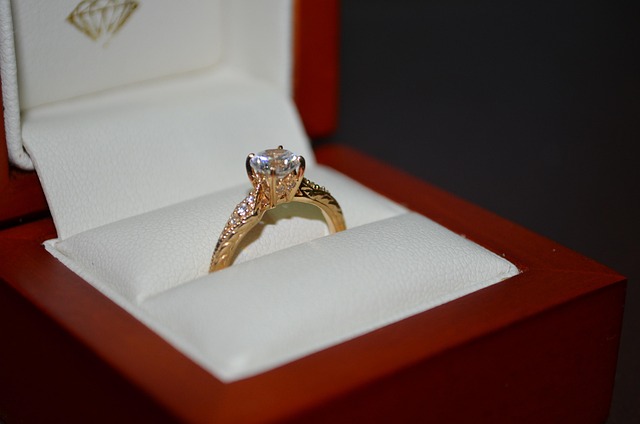 Hands wearing a delicate ring with jewel